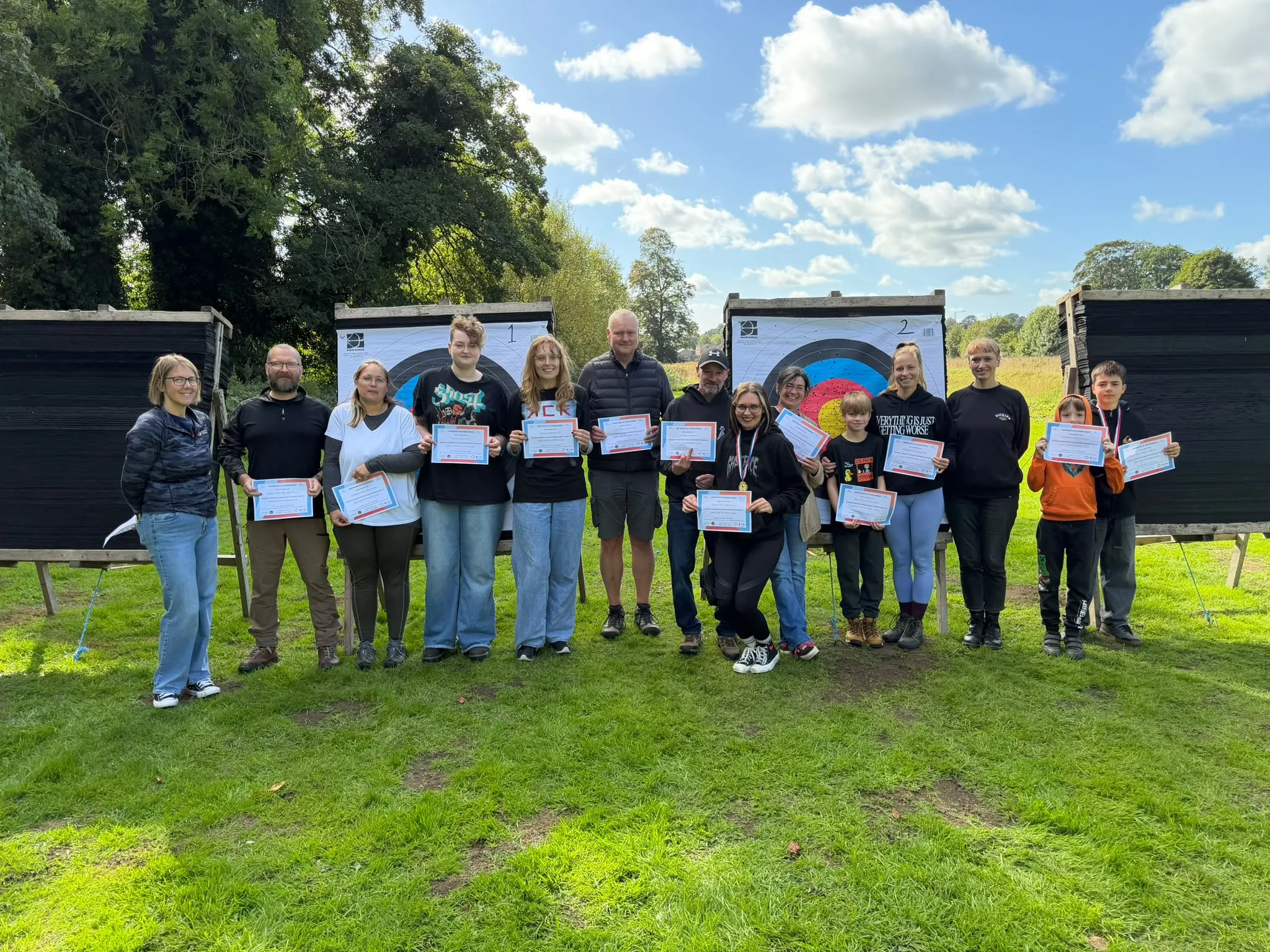 Beginner’s course finishers holding their certificates